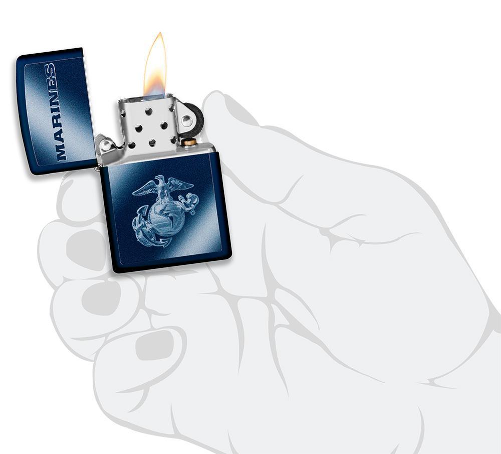 U.S. Marines Corps. Navy matte windproof lighter in hand and lit